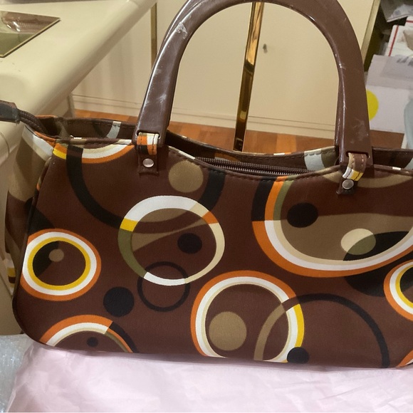 Kate Spade BrownGeometric Satchel has scratches on the handles.
